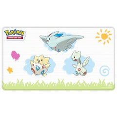 Spread kindness and joy with this Stitched Playmat for Pokemon TCG that features vibrant, full-color artwork of Togepi, Togetic, and Togekiss! Made with a soft fabric top to reduce damage to cards during play, and features a non-slip rubber backing to keep the playmat from shifting during use. The stitched edges offer an added premium feel, which enhances your gameplay experience. With dimensions of approximately 24 in. x 13.5 in., a playmat also makes an excellent oversize mousepad for home or office.