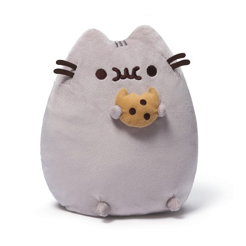 GUND is proud to present Pusheen — a chubby gray tabby cat that loves cuddles, snacks, and dress-up. As a popular web comic, Pusheen brings brightness and chuckles to millions of followers in her rapidly growing online fan base. This 9.5” upright plush version of Pusheen satisfies her sweet tooth with a tasty-looking chocolate chip cookie. Surface-washable for easy cleaning. Appropriate for ages one and up. About GUND: For more than 100 years, GUND has been a premier plush company recognized worldwide for q