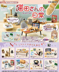 The Re-Ment Life with Cats Miniature Series brings the adorable world of cats to life with eight unique collectible sets. Each set features everyday moments between cats and their owners, like cat towers and mealtime scenes, all in beautifully detailed miniatures. Every box contains a random surprise set, making it a fun experience for collectors and cat lovers alike. These expertly crafted miniatures are perfect for displays, dioramas, or adding a whimsical touch to your desk. Ideal for Re-Ment enthusiasts