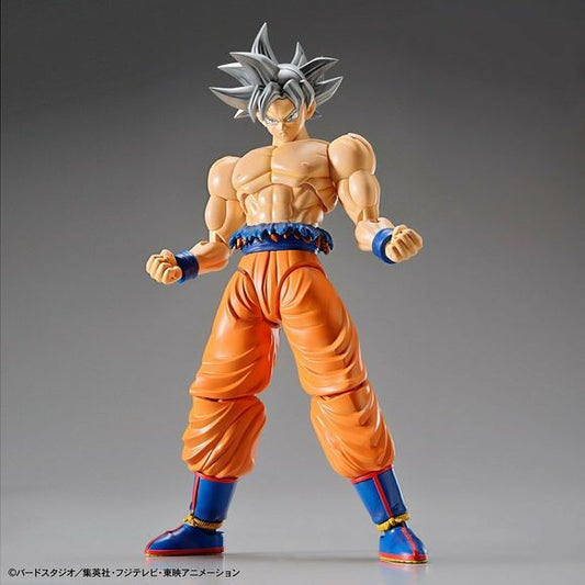 Goku's most powerful state, Ultra Instinct, joints Figure-rise Standard! His extremely muscular body under his Gi has been faithfully recreated along with the shredded uniform that flaps above his waist belt. The iconic silver hair and face are molded in multiple sections of plastic that reduce the need for painting but still allow for a sharp sculpt. Includes multiple hand parts, interchangeable faces such as the clenched teeth expression in his fight with Jiren, and Kamehameha effect parts. Runner x7,