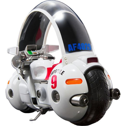 Expected to ship in January of 2026
From the first episode of "Dragon Ball", the bike Bulma was riding has appeared in S.H.Figuarts!
The roof panel and turn signal, head・tale lamp are molded in translucent plastic. The frame, front fork, muffler, and footrests are all made of diecast metal, giving the bike a satisfying sense of weight. It even comes with a display stand featuring the Capsule Corp. logo. It also includes an in-scale Goku. Plus, the stand lets you pose the bike statically, as if riding, or