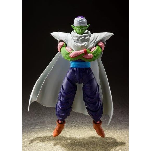 "No longer am I Kami or Piccolo...I am the Namek who has long since forgotten his name.''
S.H.Figuarts is proud to announce the reissue of Piccolo: The Proud Namekian figure, featuring the iconic enhanced joint system. A removable cape, plus a support for displaying the cape billowing open, and optional head parts let you capture a wide range of display situations (Tamashii STAGE sold separately). Other options include injured arm and crossed-arm parts, letting you capture Piccolo in all his proudly expres