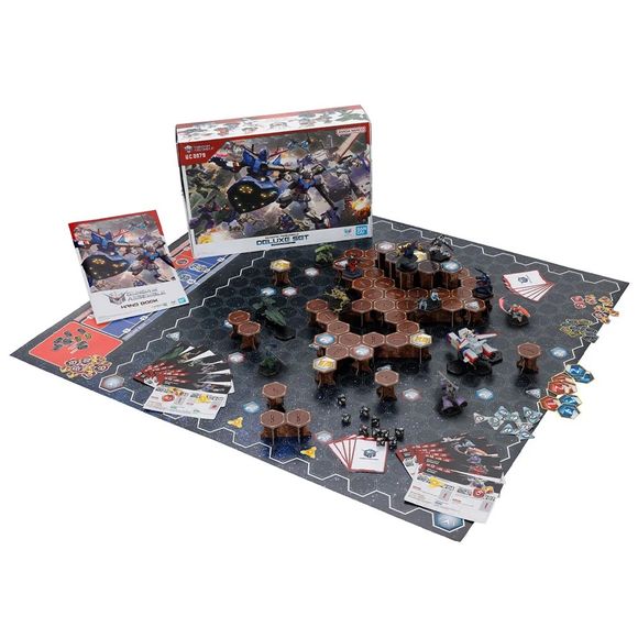 PRE-ORDER: Expected to ship in October 2026
Mobile Suits from all worlds and timelines gather together for the ultimate clash in this all-new miniatures tabletop game! The modeling techniques honed through Gunpla have finally reached a new stage where you can "play by fighting."
A deluxe set featuring narrative scenarios inspired by the animated series, and a larger 5-on-5 game board. Its main scenario is based on the Battle of A Baoa Qu, but it also comes with materials for one universal 5-on-5 scenario