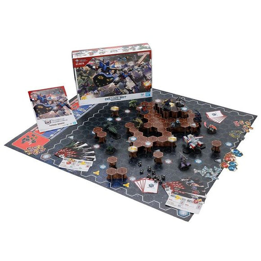 <p><strong>PRE-ORDER: Expected to ship in October 2026</strong></p>
<p>Mobile Suits from all worlds and timelines gather together for the ultimate clash in this all-new miniatures tabletop game! The modeling techniques honed through Gunpla have finally reached a new stage where you can "play by fighting."</p>
<p>A deluxe set featuring narrative scenarios inspired by the animated series, and a larger 5-on-5 game board. Its main scenario is based on the Battle of A Baoa Qu, but it also comes with materials
