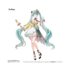 <p><strong>PRE-ORDER: Expected to ship in May of 2027.</strong></p>
<p>Hatsune Miku teams up with <strong>TIROL CHOCO</strong> for a special alternate-color version of the <strong>Coffee Nougat</strong> collaboration figure from FuRyu!</p>
<p>Based on artwork by <strong>Hiten</strong>, Hatsune Miku is dressed in an elegant confectionery-inspired outfit featuring soft white tones, turquoise accents, and warm gold and yellow details unique to this <strong>Another Color Ver.</strong> Her flowing twin tails,