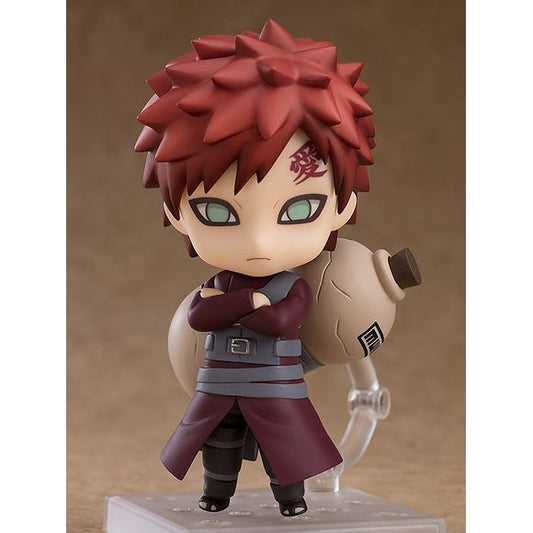 From Good Smile Company. The composed look of Gaara after becoming the Fifth Kazekage has been faithfully converted into Nendoroid size! His iconic sand gourd has the little cracks and markings all faithfully included on the design. The opening of the sand gourd has sand parts which can be connected in order to display Gaara making use of his sand manipulation techniques. The texture of the effect parts has been carefully tuned for a sandy appearance.Two large sand parts are included which can be placed aro