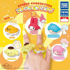 Sanrio Characters Fashion Ring Capsule Gashapon features: Pompompurin, Gudetama, My Melody, Little Twin Stars (Kiki), and Little Twin Stars (Lala)
This contains one random plastic ring in a gashapon ball.