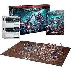 This boxed set includes:
1x 64-page softcover Warhammer 40,000 Starter Set Handbook
38x plastic push-fit Citadel miniatures
11x Space Marines
- 1x Captain in Terminator Armour:
- 5x Terminators:
- 5x Infernus Marines:
27x Tyranids
- 1x Winged Tyranid Prime
- 1x Psychophage
- 3x Von Ryan’s Leapers:
- 20x Termagants
- 2x Ripper Swarm
2x reference sheets
1x 30" by 22.4" double-sided gaming mat
2x range rulers and 10x six-sided dice