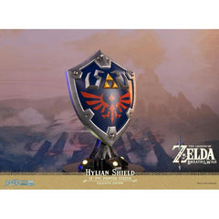 This statue has no edition number, and was a replacement and is in new and unopened condition.
First 4 Figures is proud to introduce their latest PVC collectible, the Hylian Shield Exclusive Edition from The Legend of Zelda: Breath of the Wild.
The blue front with silver borders, the Triforce symbol, and Hyrule's crest are staples in its classic design, and this particular statue was inspired by the design from The Legend of Zelda: Breath of the Wild.
As for the base it's mounted on, the Hylian Shield a