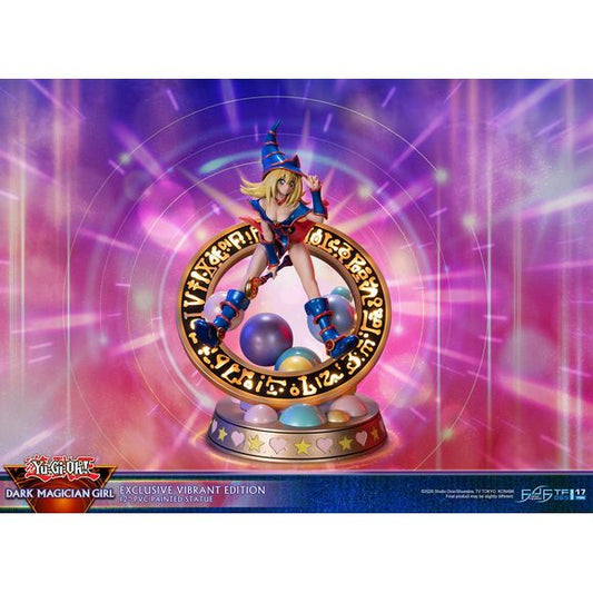 This statue has no edition number, and was a replacement and is in new and unopened condition. 
The “Vibrant” variation features Dark Magician Girl wearing a dark purple dress accented by dark pink details. For the exclusive edition, the Magician’s seal lights up with 2 LED functions: Static and Animated. When animated, lights swirl around the ring of the Seal as if Dark Magician Girl is preparing to use her Dark Burning Attack!