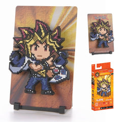 When Yugi lets the spirit of the ancient Pharaoh inside him, he becomes Yami Yugi. A master duelist, Yami Yugi is confident and skilled—and a fierce opponent.
FiGGYZ are Pop Magnet Collectibles - pixel-art characters that snap magnetically onto display-ready backdrops.
Each one features:
A reversible metal display
Side A: Themed background related to the character
Side B: Classic Background, typically of the franchise
A magnetized figure raised off the surface using MagMounts™ for a 3D pop out feeling
Co