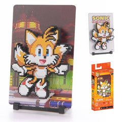 A brilliant two-tailed fox and expert inventor, always ready to build, fly, and fight alongside Sonic.
FiGGYZ are Pop Magnet Collectibles - pixel-art characters that snap magnetically onto display-ready backdrops.
Each one features:
A reversible metal display
Side A: Themed background related to the character
Side B: Classic Background, typically of the franchise
A magnetized figure raised off the surface using MagMounts™ for a 3D pop out feeling
Comes with a display base for shelves and a magnetic stick