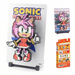 <p><strong>FiGGYZ Sonic the Hedgehog – Amy #260</strong> brings Sonic’s energetic pink hedgehog companion to life in bold magnetic pixel-art style. This collectible features a layered 3D pop-out design with a reversible metal backdrop and flexible display options for shelves, desks, walls, or other magnetic surfaces.</p>
<p>Perfect for Sonic the Hedgehog fans, SEGA collectors, retro gaming enthusiasts, and pop culture displays, Amy #260 adds bright character to any FiGGYZ collection. Pair her with Sonic, T