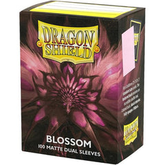 Dragon Shield Standard Matte Dual sleeves have a clear front and a textured matte back. They are fully opaque, with a black interior, which makes for an elegant backdrop for black bordered cards.
The sturdy cardboard box fits 75+ single sleeved cards or 65+ double sleeved cards measuring up to 63 x 88 mm (2.5 x 3.5"), for games like MTG, Pokemon, Flesh and Blood, and Lorcana! Every box has a label at the top of the box for personalization.