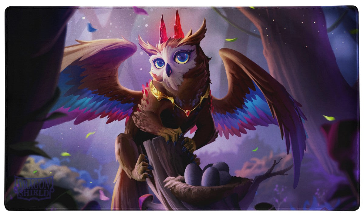 Take to the skies and defend your deck with The Dragowlis playmat. This owl-dragon's cuteness will turn heads 180� and might cause opponents to go *hoot hoot*. The Dragowlis is part of the absolutely adorable Spirit Animals series. Enjoy the new, silky smooth surface texture. Together with the non-slip, rubber bottom and premium stitched-edge, your playmat will stay in place and see you through countless adventures. Our sturdy art tube provides convenient storage and transport, so you can take your playma