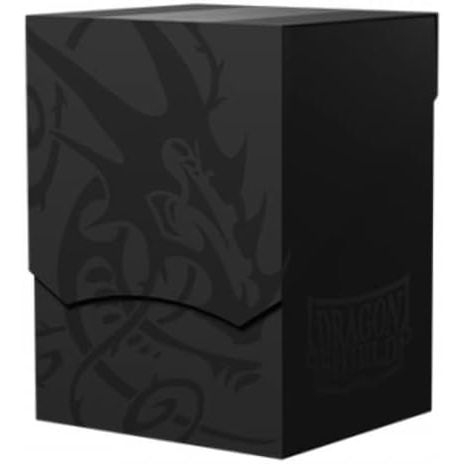 Dark shadow black, the grim darkness of a mid-day eclipse, with subtle dragon embossing. The Deck Shell is an elegant and compact deck box you can trust to keep your cards safe and secure. The lid sits securely while closed and can be set underneath the Deck Shell for a minimal footprint. The deep cutout provides easy access to your cards. Each Deck Shell comes with a divider and has a writing field for personalization and organization. The Deck Shell will fit: 100 single sleeved cards 80 double sleeved car