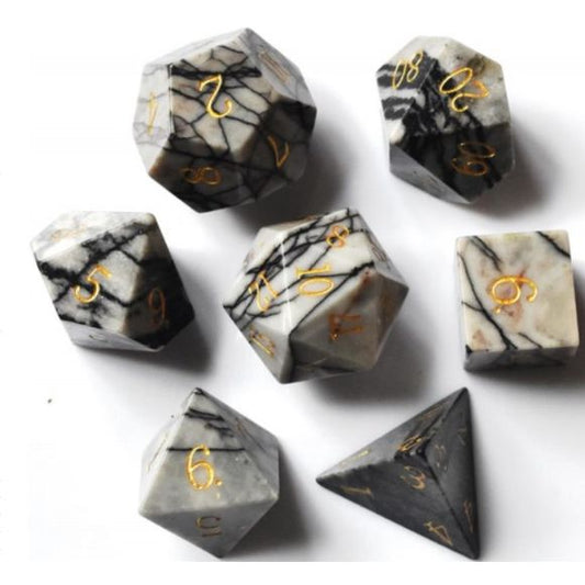 The perfect companion for your gaming needs! These premium, high-end cut stone polyhedral dice are exactly what you've been searching for that upcoming game night with the group. Each set weighs roughly 8 ounces and are stored in a quality, brushed metal tin with foam insert. These dice are a rich quality stone with nice weight to them and engraved each with crisp, easy-to-read numerals. Many styles and colors are available.
This set includes one of each: d20, d12, d10, d10 (percentile), d8, d6, and a d4 (