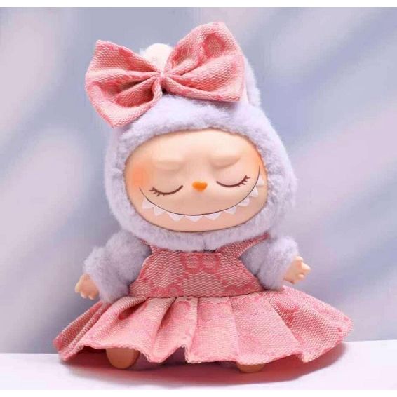 Outfit includes a dress and bow perfectly designed to fit your favorite Labubu. Customize and accessorize yours today! Does not include Labubu