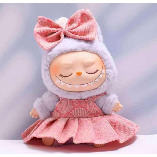 Outfit includes a dress and bow perfectly designed to fit your favorite Labubu. Customize and accessorize yours today! Does not include Labubu