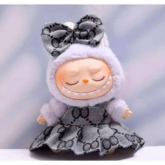 Outfit includes a dress and bow perfectly designed to fit your favorite Labubu. Customize and accessorize yours today! Labubu not included.