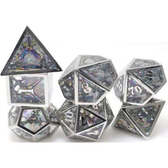 The perfect companion for your gaming needs! These premium dice are exactly what you've been searching for that upcoming game night with the group. Stored in a quality, brushed metal tin with foam insert. These dice are engraved with crisp, easy-to-read numerals. Many styles and colors are available.
This set includes on of each: d20, d12, d10, d10 (percentile), d8, d6, and a d4 (7 dice in total). All inside the Galactic Toys Dice Tin.