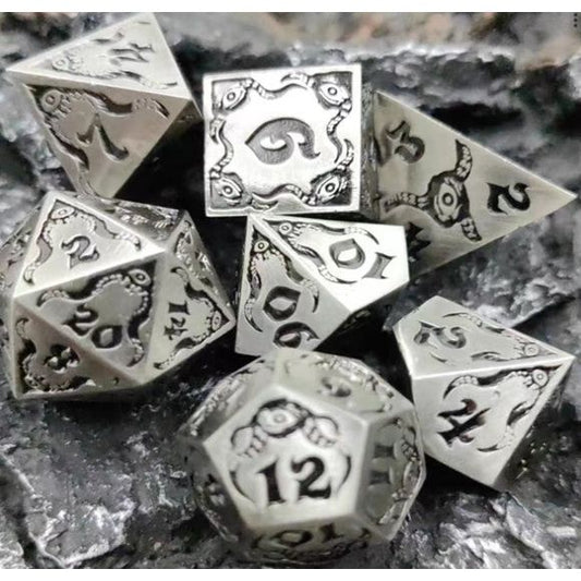 The perfect companion for your gaming needs! These premium die-cast polyhedral dice are exactly what you've been searching for that upcoming game night with the group. Stored in a quality, brushed metal tin with foam insert. These dice are a rich metal with nice weight to them and engraved each with crisp, easy-to-read numerals. Many styles and colors are available.
This set includes one of each: d20, d12, d10, d10 (percentile), d8, d6, and a d4 (7 dice in total). All inside the Galactic Toys Dice Tin.