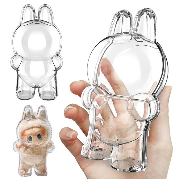 Labubu Clear Protective Case Cover, Standing Version – crystal-clear shell for Labubu plush and vinyl figures. Keep your Labubu safe and looking adorable wherever you go with this crystal-clear protective shell, shaped specifically to fit Labubu's iconic silhouette (bunny ears and rounded body included) in the standing pose.
Made from sturdy, transparent plastic to shield your plush from dirt, dust, scratches, and light rain — lightweight yet strong enough to clip to backpacks, bags, or display shelves. Fu