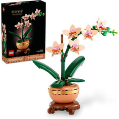 Let your creativity blossom with the LEGO Botanicals Mini Orchid (10343) building kit for adults. This decorative plant makes a great gift for women, men and gardeners. Use adult building blocks to make the DIY orchid as a stunning floral display, complete with a light terracotta flowerpot and a beautiful wood-effect plinth. The lifelike replica features 5 orchids in bloom and a few budding flowers, plus leaves for extra greenery. And it never needs to be watered! Bring the tranquility of nature into any li