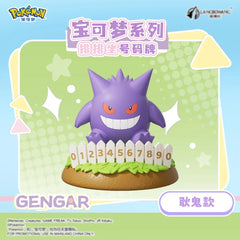 Add a mischievous touch to your Pokémon collection with this Gengar Number Plate Display Figure by Langbowang! Featuring the Ghost-type favorite flashing its iconic grin from behind a decorative white picket fence, this collectible combines spooky charm with a fun interactive display element.
Gengar's signature purple coloring, piercing red eyes, and toothy smile are faithfully recreated in a cute, stylized design that captures the playful side of this fan-favorite Pokémon. The figure sits atop a grassy di