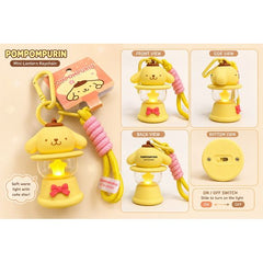 Bring a warm glow wherever you go with this adorable Pompompurin Light-Up Lantern Keychain! Featuring Sanrio's lovable golden retriever character perched atop a miniature lantern, this charming accessory doubles as both a collectible keychain and a functional LED light. A glowing star-shaped light shines through the lantern chamber, creating a cozy ambiance that's perfect for backpacks, purses, keys, or display shelves.
Designed with a sturdy carabiner clip and matching wrist strap, it's easy to attach and