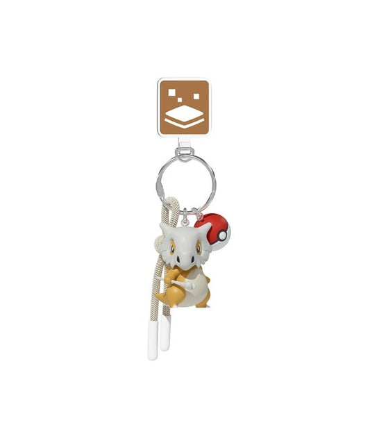 Take your favorite Ground-type Pokémon wherever you go with this adorable Cubone Keychain! Featuring a detailed 3D Cubone figure complete with its iconic skull helmet and bone club, this collectible accessory captures the beloved Pokémon's unique look in a compact and portable design.
The keychain includes a classic Poké Ball charm, a matching wrist strap, and durable metal hardware for easy attachment to keys, backpacks, purses, luggage, and more. Crafted from high-quality PVC with vibrant colors and fine