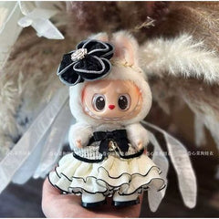 Outfit includes an elegant party dress and a flower headband for your favorite Labubu. Customize and accessorize yours today! Labubu not included.