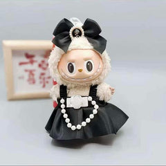 What are you wearing to the Gala? Outfit includes a lovely dress and bow for your favorite Labubu. Customize and accessorize yours today! Labubu not included.