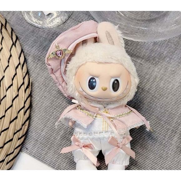 All hail her royal highness, Princess Labubu! Out for a casual outing with the finest fashion Outfit includes a hat with jewelery, shoes, cape, corset, and pants for your favorite Labubu. Customize and accessorize yours today! Labubu not included.