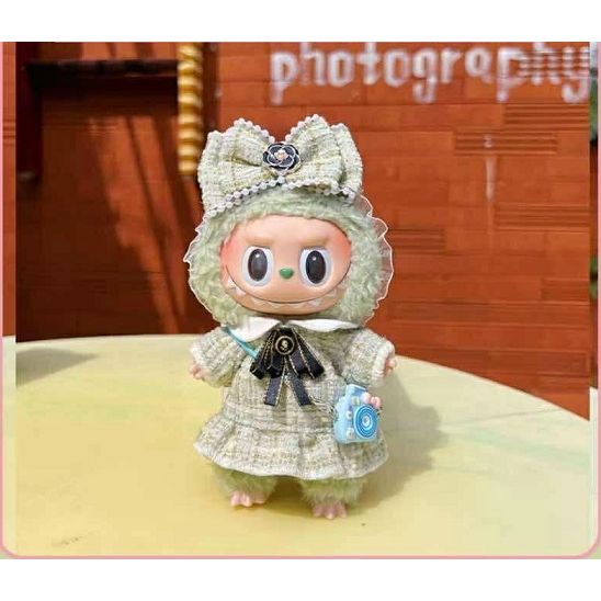 Outfit includes camera/bag, bow with lovely floral design and a dress. Customize and accessorize yours today! Labubu not included.