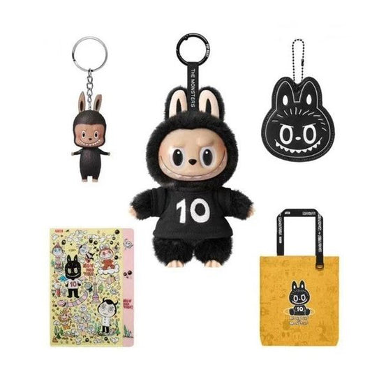 Bundle Includes:
1 × “Labubu 10th Anniversary” vinyl plush pendant (new edition)
1 × “Mirror charm / pendant” (for Set B) — distinguishes it from Set A which uses a pom-pom pendant.
1 × Yellow tote bag (canvas 10th anniversary print)
1 × Yellow folder (anniversary themed)
1 × Mini Labubu keychain blind box