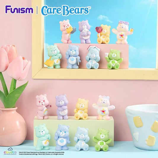 Add a burst of color and cuteness to your collection with the Care Bears: Little Things Series – Cubby Face blind box figures from Funism. This unique series features adorable mini Care Bears in a soft pastel style, each designed with charming expressions and a cozy, feel-good aesthetic.
Packaged inside a bear head-shaped capsule, each blind box delivers a fun twist—you don’t just get one figure, you get three mini Care Bears inside every box. Perfect for collectors and gift-giving, this multi-figure forma