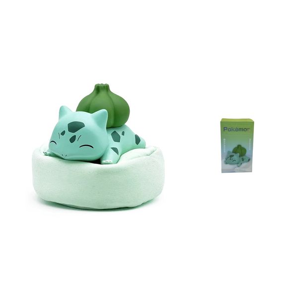 Bring a touch of Pokémon charm to your collection with this adorable Bulbasaur Sleeping Figure! Featuring Bulbasaur peacefully resting atop a soft cushion-style base, this collectible captures one of the Kanto region's most beloved Pokémon in a relaxed and heartwarming pose.
Beautifully sculpted with vibrant colors and attention to detail, this display piece is perfect for Pokémon fans, collectors, and anyone looking to add a cute accent to their desk, shelf, or display case. The included cushion-style bas