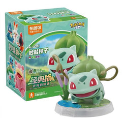<p>Add one of the original Kanto starters to your collection with the <strong>Blokees Pokémon Classic Edition Bulbasaur Figure</strong>!</p>
<p>This officially licensed Pokémon collectible features <strong>Bulbasaur</strong> in Blokees' stylized figure format, with a cute, faithful design based on the classic Pokémon appearance.</p>
<p>The figure includes articulated joints for simple posing and comes with themed display parts to create a small character scene. The bright colors and compact size make it a