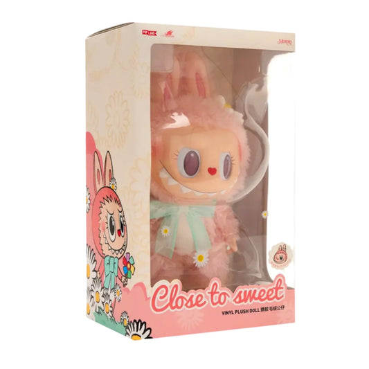 Add a touch of charm and sweetness to your collection with the Mokoko Close to Sweet Vinyl Plush Doll, a beautifully crafted 38 cm figure designed with Pop Mart’s signature blend of cuteness, style, and display presence. Standing tall at nearly 15 inches, this collectible seamlessly combines soft plush textures with durable vinyl elements, giving Mokoko a premium, high-quality look perfect for shelves, desks, and display cases.
With her soft pastel color palette, expressive features, and adorable outfit st