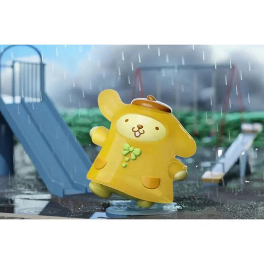 Rainy days are more fun with Pompompurin! The LANGBOWANG x Sanrio Characters It's Raining Day! Series brings beloved Sanrio characters to life in adorable weather-themed designs, and this cheerful Pompompurin figure is ready to splash through puddles in style.
Dressed in a bright yellow raincoat decorated with a lucky clover accent, Pompompurin captures the playful spirit of a rainy afternoon. Featuring detailed sculpting, vibrant colors, and a whimsical puddle-effect display base, this collectible makes a