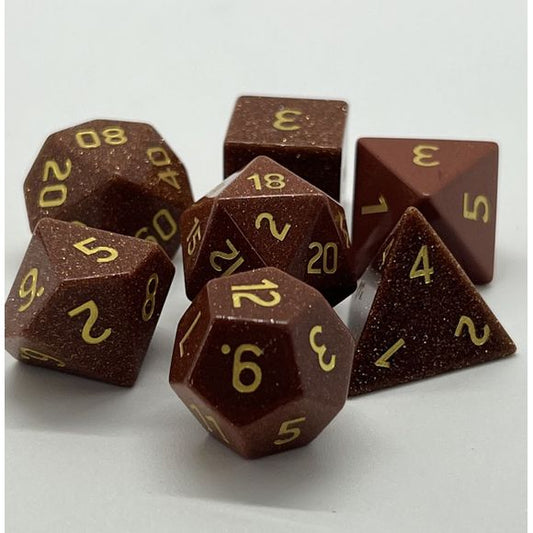 The perfect companion for your gaming needs! These premium, high-end cut stone polyhedral dice are exactly what you've been searching for that upcoming game night with the group. Each set weighs roughly 8 ounces and are stored in a quality, brushed metal tin with foam insert. These dice are a rich quality stone with nice weight to them and engraved each with crisp, easy-to-read numerals. Many styles and colors are available.
This set includes on of each: d20, d12, d10, d10 (percentile), d8, d6, and a d4