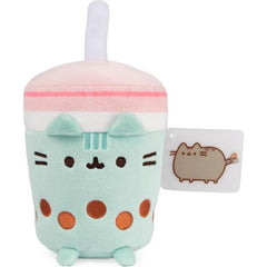 This eye-catching mint-green Pusheen boba cup plush stands six inches tall, complete with a straw, pink lid, and amber-colored embroidered tapioca pearls. Adorned with Pusheen’s signature smile, whiskers, striped tail, and feet, this tea sip is perfect for foodies and Pusheen collectors alike!