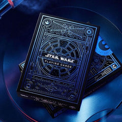 EMBOSSED AND FOIL STAMPED. The outer packaging features blue foil and reflective clear foil detailing, creating a window-like design effect inspired by the Millennium Falcon. The deck includes themed design elements based on the Star Wars universe.
ALL CUSTOM COURT CARDS. Each deck has a set of 12 court cards, with iconic Light Side characters. Each card features detailed depictions of these iconic heroes: Luke Skywalker, Obi-Wan Kenobi, Rey, Leia Organa, Han Solo, and more!
LOADED WITH DETAILS. Across the