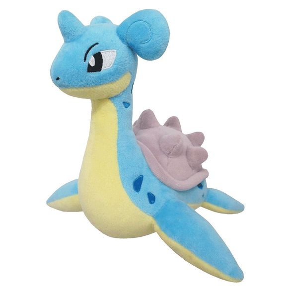 Lapras is a large sea creature that resembles a plesiosaur. It has a spotted, blue hide with a cream underside. Its neck is long, and it has large black eyes. There is a short horn in the middle of its forehead and curled ears placed farther back on its head. Instead of legs, it has four flippers with the foremost pair being larger than the hind. On its back is a heavy, gray shell covered in blunt knobs.