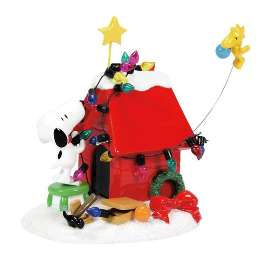 Get your house dressed up and ready for the holidays with this festive Peanuts decoration! The decoration features everyone’s favorite duo - Snoopy and Woodstock - decorating Snoopy’s dog house with Christmas lights and other festive decorations! This is perfect to place on your mantle during the holiday season, or to gift to a friend or family member who is a fan of the classic tv show, comic, or holiday movie! This decoration was meticulously crafted and hand-painted for top-notch quality. This product is