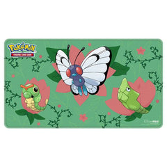 This premium stitched-edge playmat for the Pokémon Trading Card Game features vibrant, full-color artwork of Caterpie, Metapod, and Butterfree among flowers reaching full bloom. The soft fabric top and non-slip rubber backing provide a safe gameplay surface that stays in place. With dimensions of approximately 24 in. x 13.5 in., this playmat also makes an excellent oversize mousepad for home or office.