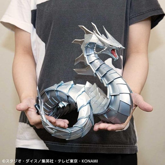<p>Summon one of the most iconic Machine monsters from <em>Yu-Gi-Oh! Duel Monsters GX</em> with the massive <strong>Cyber Dragon Big Size Figure</strong> from Kaiyodo!</p>

<p>Used as the signature ace monster of Zane Truesdale's Cyber Deck, Cyber Dragon is recreated as an imposing large-format display statue with its long mechanical body coiled upward in a threatening pose.</p>

<p>The metallic silver finish is enhanced with subtle blue-toned shading that brings out the intricate mechanical sculpting throu