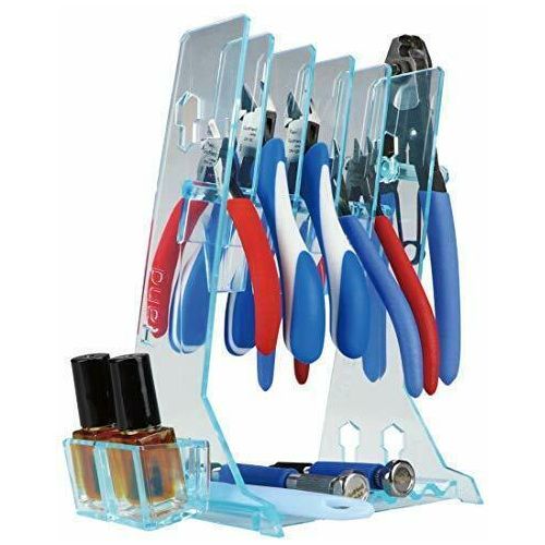 Tools such as nippers and pliers that tend to become cluttered during work can be stored stylishly and safely.  Organize your workspace and improve your production efficiency!  Up to 5 nippers or pliers can be stored on this stand.  The stand is made of highly flexible resin, so it is difficult to break. The bottom of the stand is ideal for storing pen-type tools such as pin vise, or hobby knives that can easily roll off your table.  Up to 7 can be stored at once!  Approximate size: Height: 190mm (7.5"), Wi