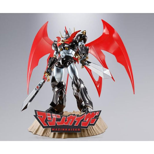 Celebrate the 20th anniversary of the "Chogokin Damashii" action-figure lineup with this special Mazinkaiser! It's gleaming with golden, silver and black plating for a luxurious color upgrade, and its display base includes a sound gimmick to play the "Mazinkaiser" theme song sung by Ichiro Mizuki! In addition to all its other weaponry, it's also packing a new Final Kaiser Blade, with the blade itself now 20 percent larger than the earlier version! Don't miss out on this spectacular giant robot -- place your